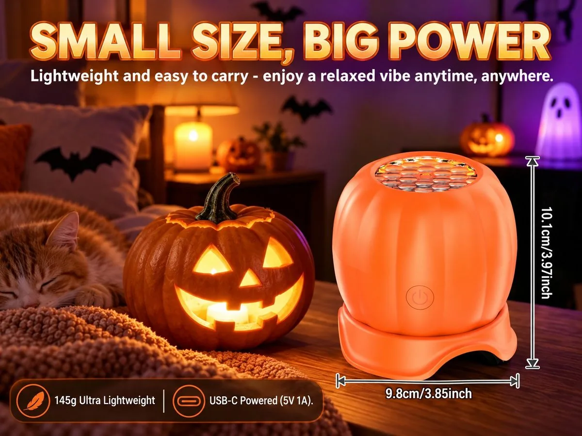 Hand holding the pumpkin projection light showing its compact portable size